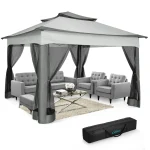 Stylish camping gazebo with gray seating and mesh curtains for outdoor relaxation
