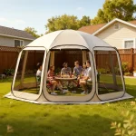 Group of friends enjoying drinks inside a spacious camping gazebo in a backyard